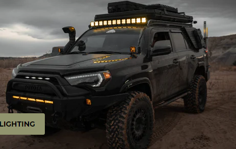 A customized 4Runner conquering a rugged off-road trail